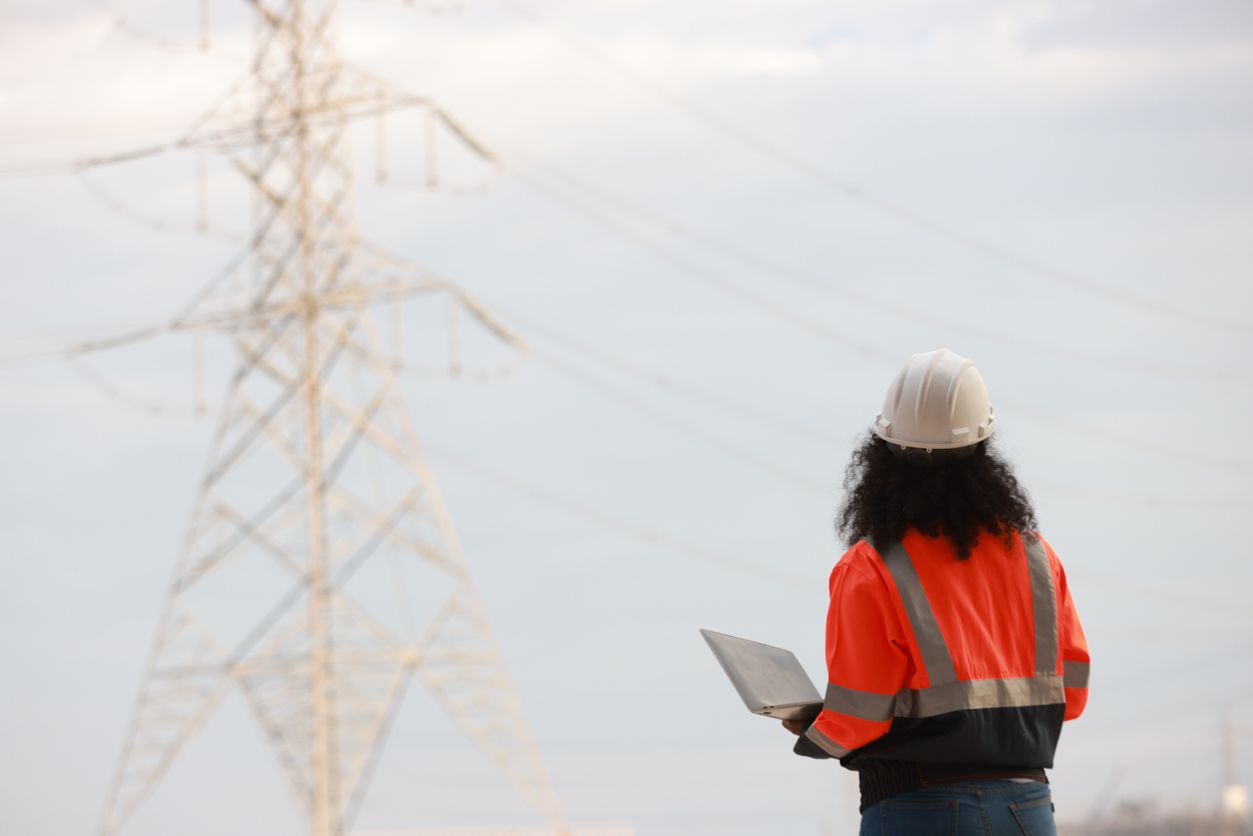 Woman in front of power line